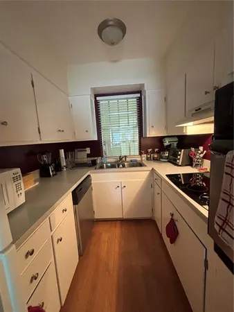 a kitchen with a stove and a microwave