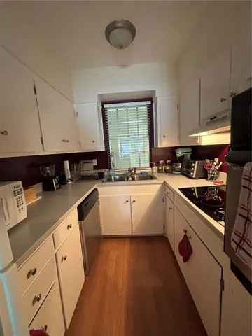 a kitchen with a stove and a microwave