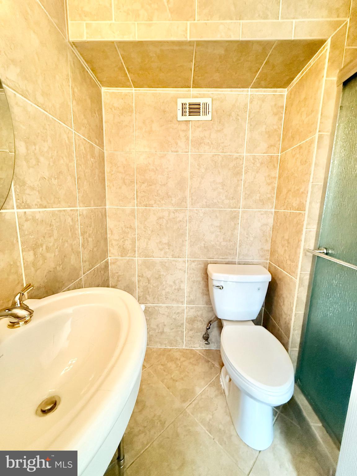 5439 Richenbacher Avenue Alexandria, VA 22304 - Photo 15 of 23 a bathroom with a toilet and a sink