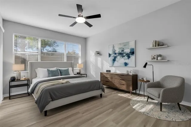 a bedroom with a bed and a couch