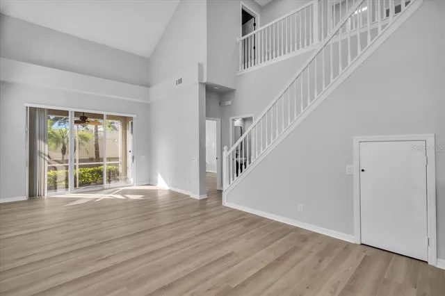 a view of an entryway with wooden floor