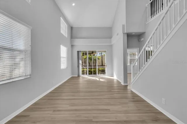 a view of an entryway with wooden floor