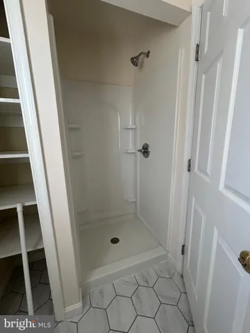 a bathroom with a toilet a sink and a window