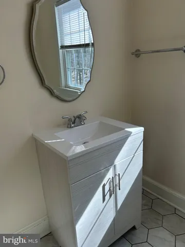 a utility room with dryer and window