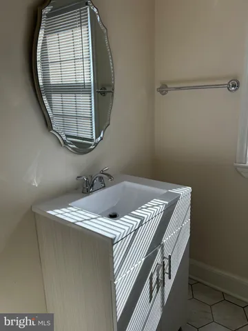 a view of a house with wooden fence