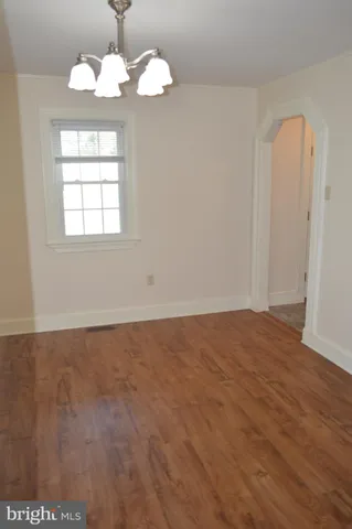 a bathroom with a toilet sink vanity and mirror
