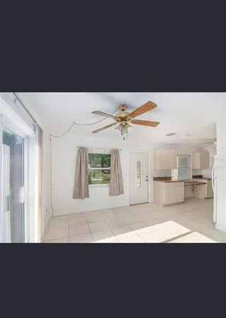a view of a living room and kitchen