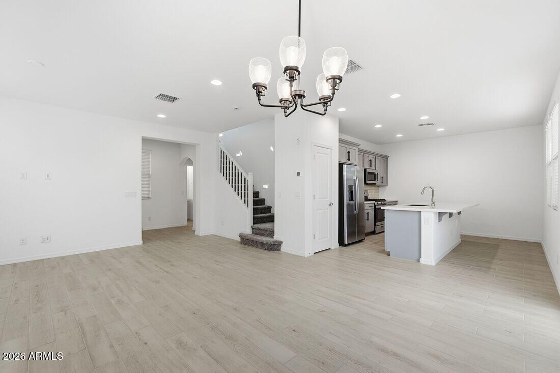 10048 West Piccadilly Road Avondale, AZ 85392 - Photo 15 of 49 a view of a kitchen and a chandelier