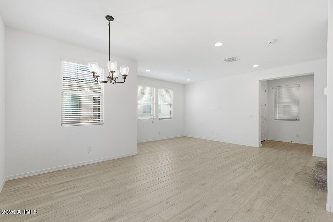 10048 West Piccadilly Road Avondale, AZ 85392 - Photo 16 of 49 a view of an empty room with window and chandelier