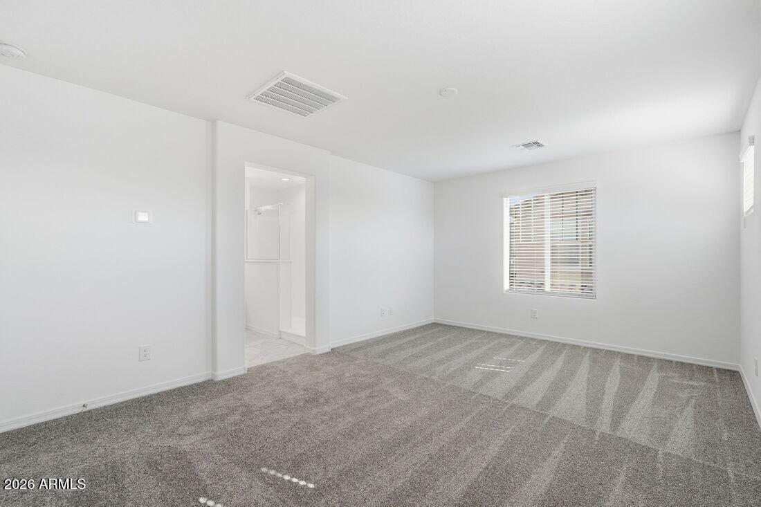 10048 West Piccadilly Road Avondale, AZ 85392 - Photo 17 of 49 a view of an empty room with a window