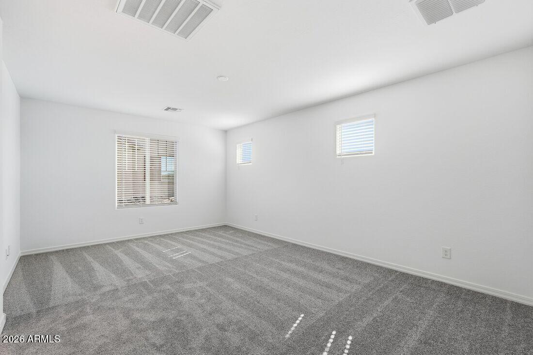 10048 West Piccadilly Road Avondale, AZ 85392 - Photo 18 of 49 an empty room with windows