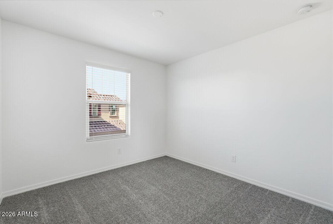 10048 West Piccadilly Road Avondale, AZ 85392 - Photo 24 of 49 an empty room with a window