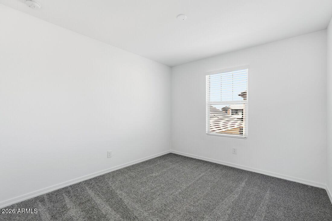 10048 West Piccadilly Road Avondale, AZ 85392 - Photo 25 of 49 a view of an empty room with a window