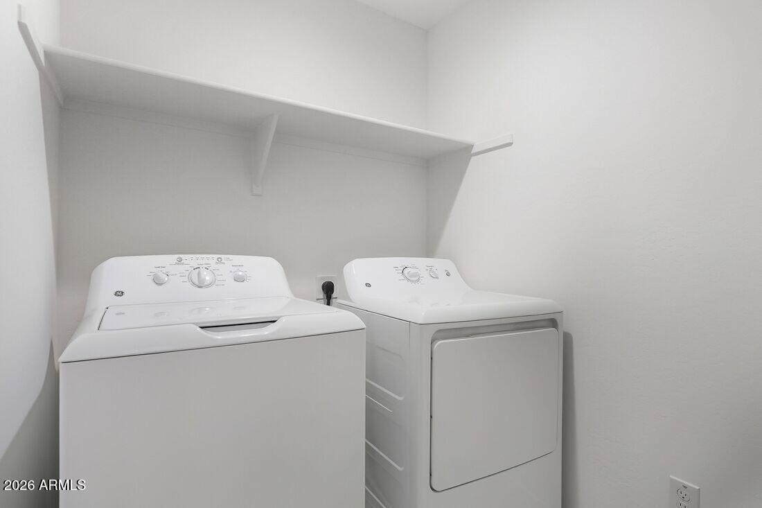 10048 West Piccadilly Road Avondale, AZ 85392 - Photo 27 of 49 a utility room with dryer and washer