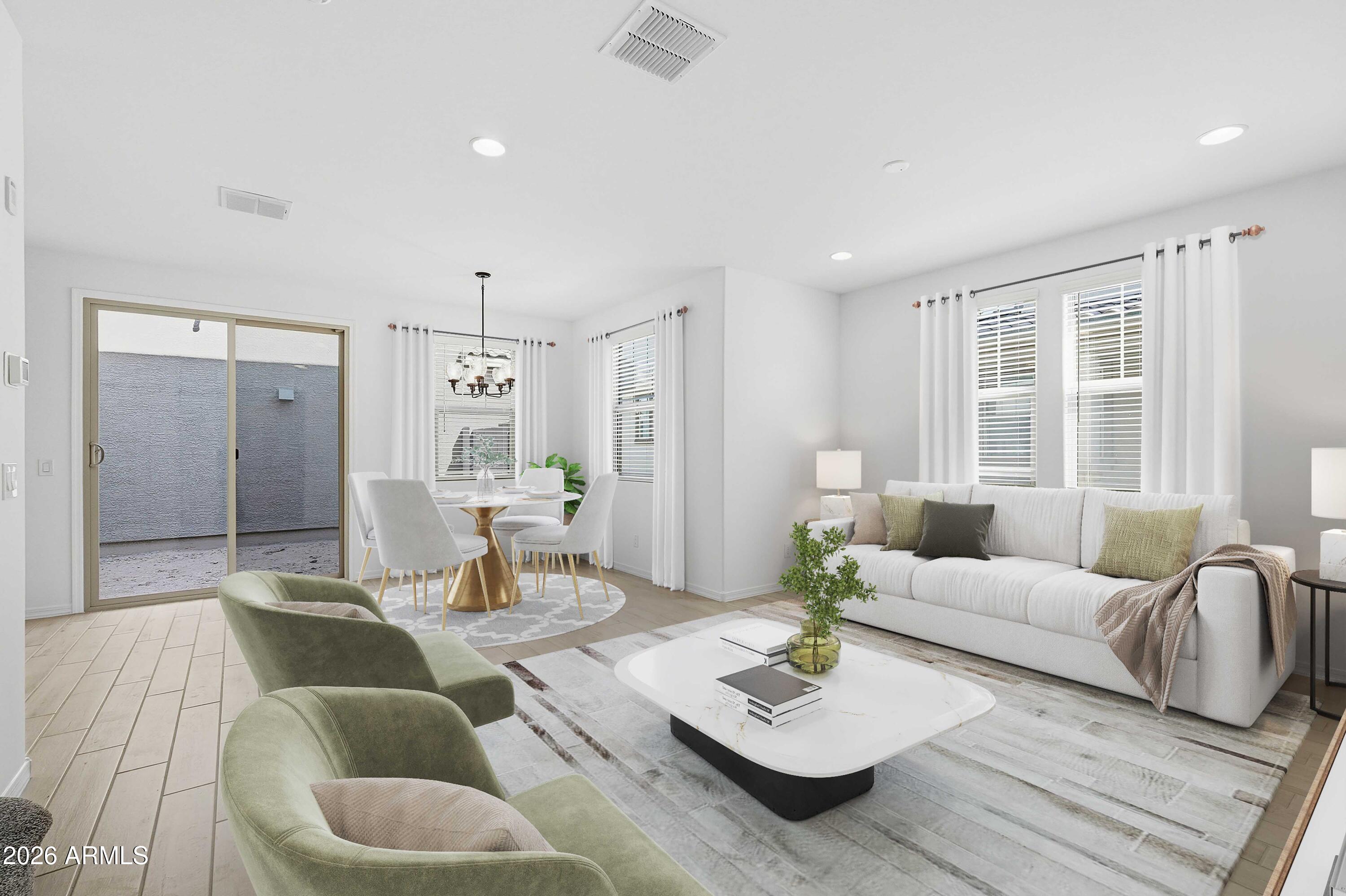 10048 West Piccadilly Road Avondale, AZ 85392 - Photo 4 of 49 a living room with furniture and a large window