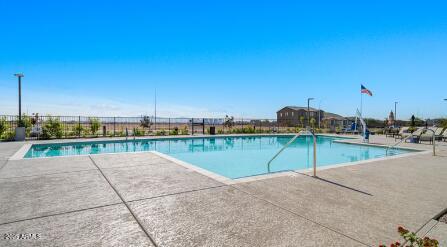 10048 West Piccadilly Road Avondale, AZ 85392 - Photo 40 of 49 a view of a swimming pool with a lake view