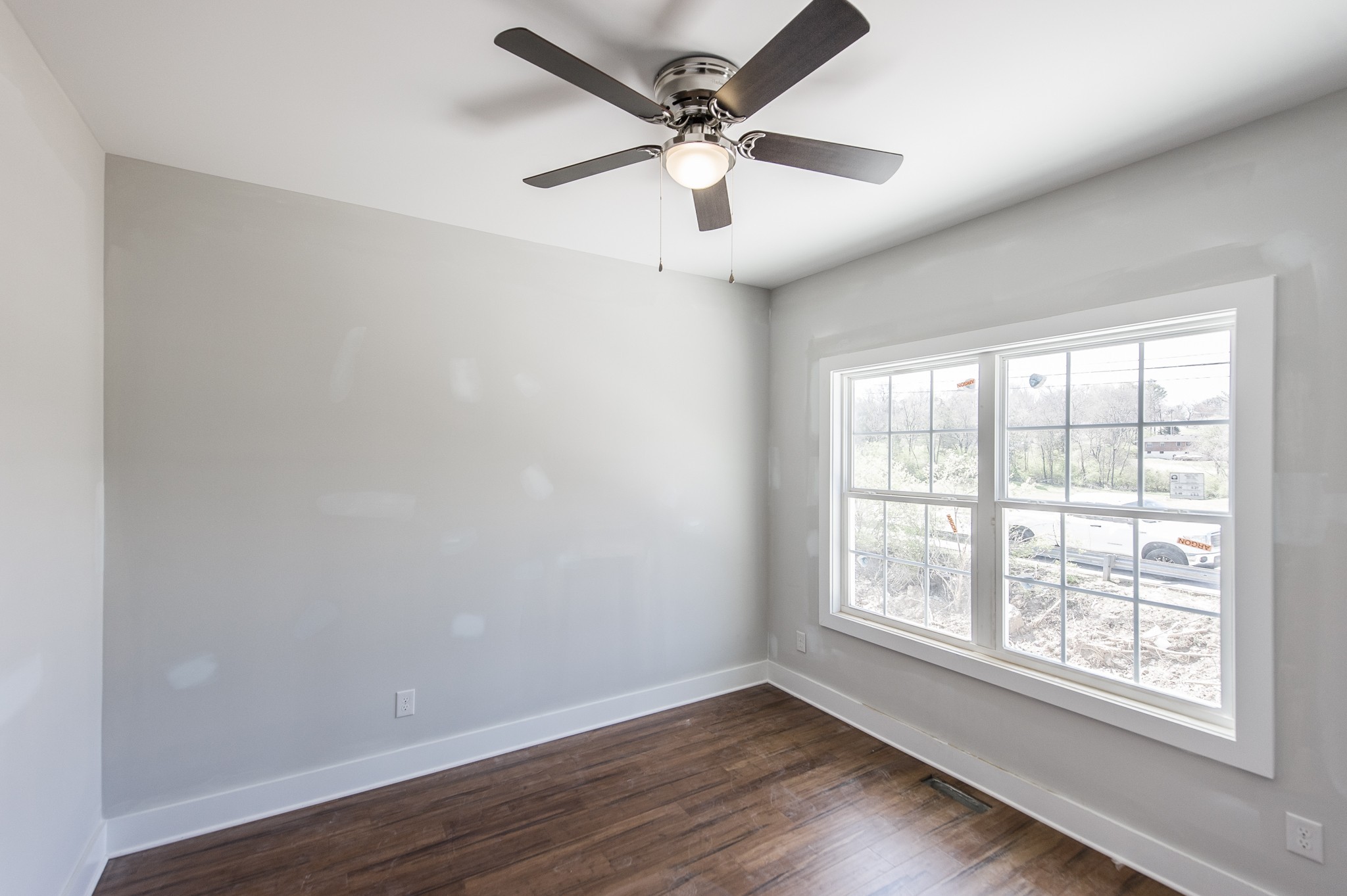 421 Elysian Fields Road, Unit 4 Nashville, TN 37211 - Photo 15 of 26 an empty room with wooden floor and windows
