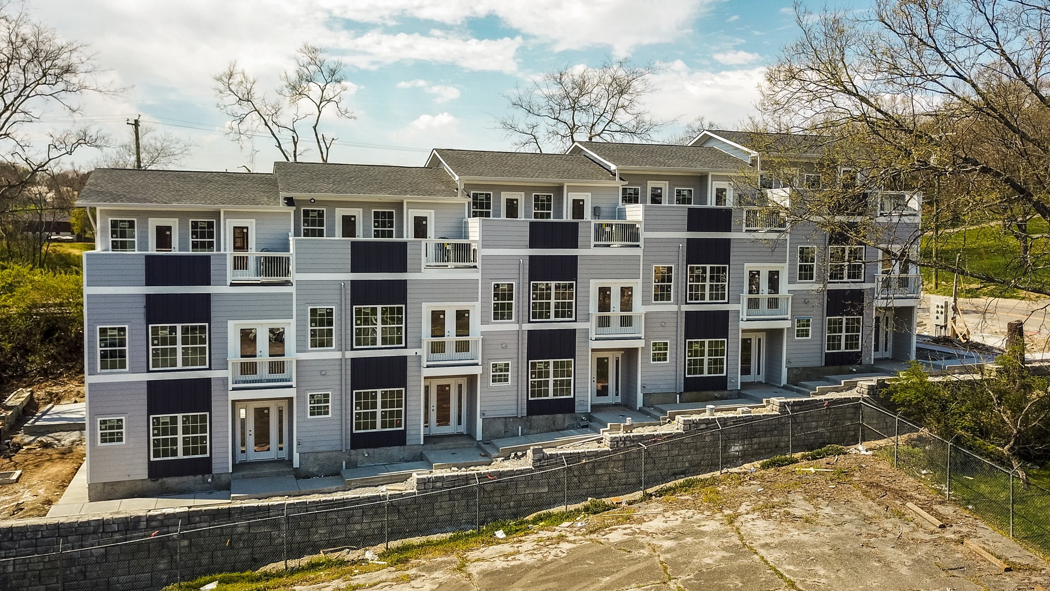 421 Elysian Fields Road, Unit 4 Nashville, TN 37211 - Photo 2 of 26 a front view of a building with a street