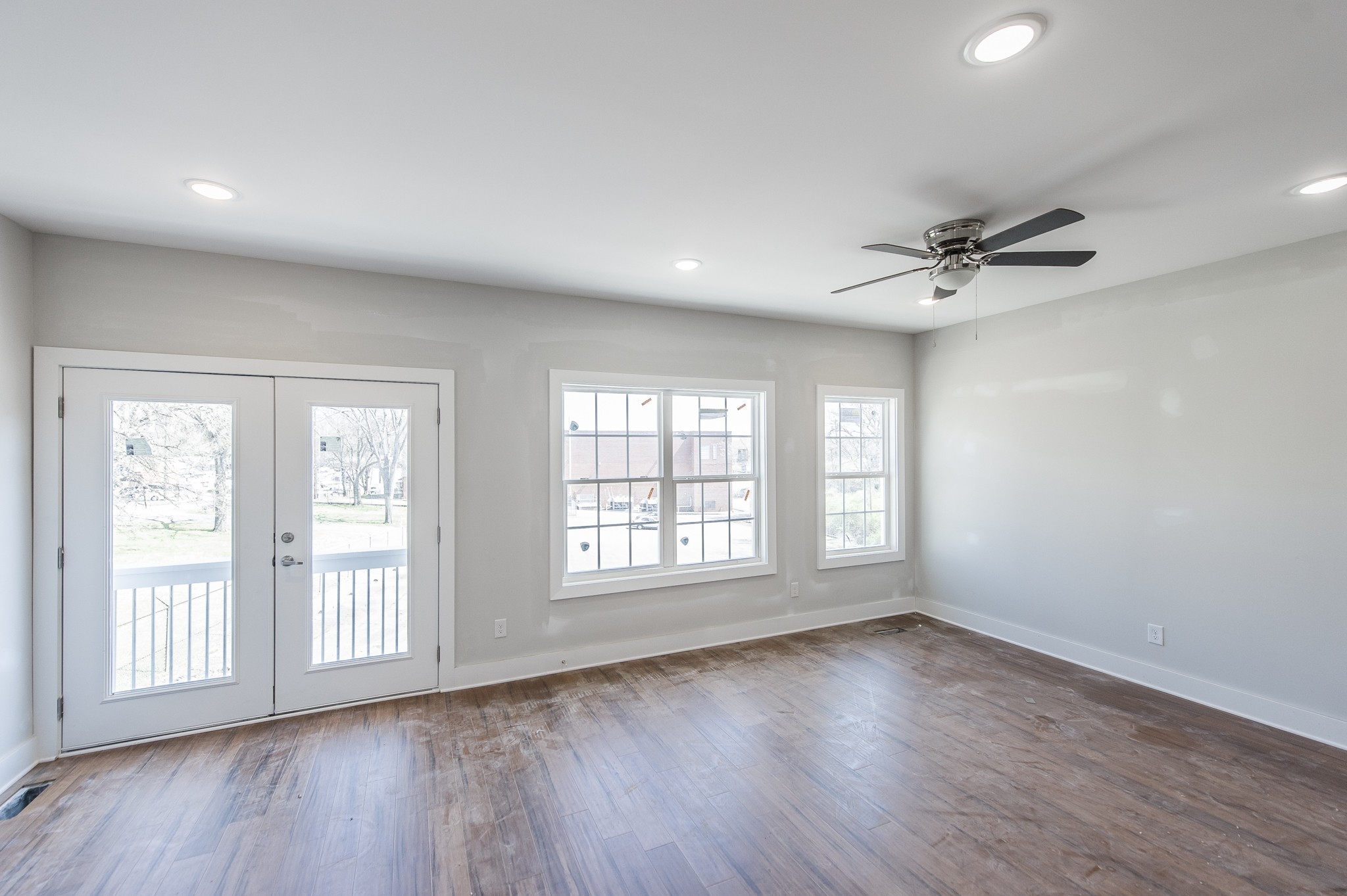 421 Elysian Fields Road, Unit 4 Nashville, TN 37211 - Photo 10 of 26 a view of an empty room with a window and wooden floor
