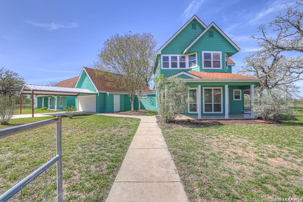 a view of front a house with a yard