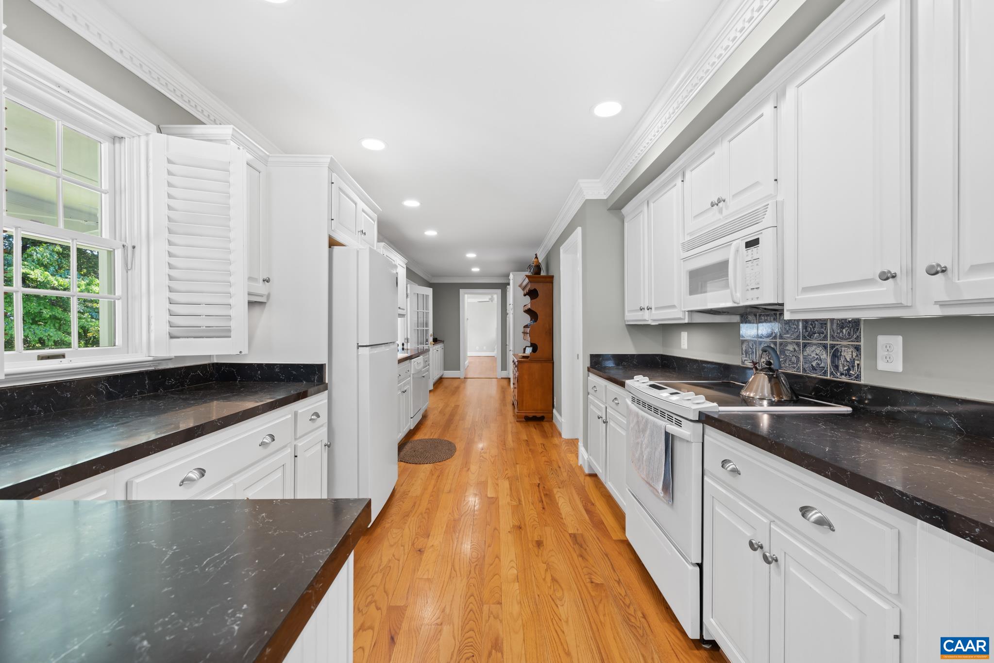 480 Dawsonville Road Barboursville, VA 22923 - Photo 7 of 55 a large kitchen with stainless steel appliances granite countertop a stove a sink and white cabinets with wooden floor