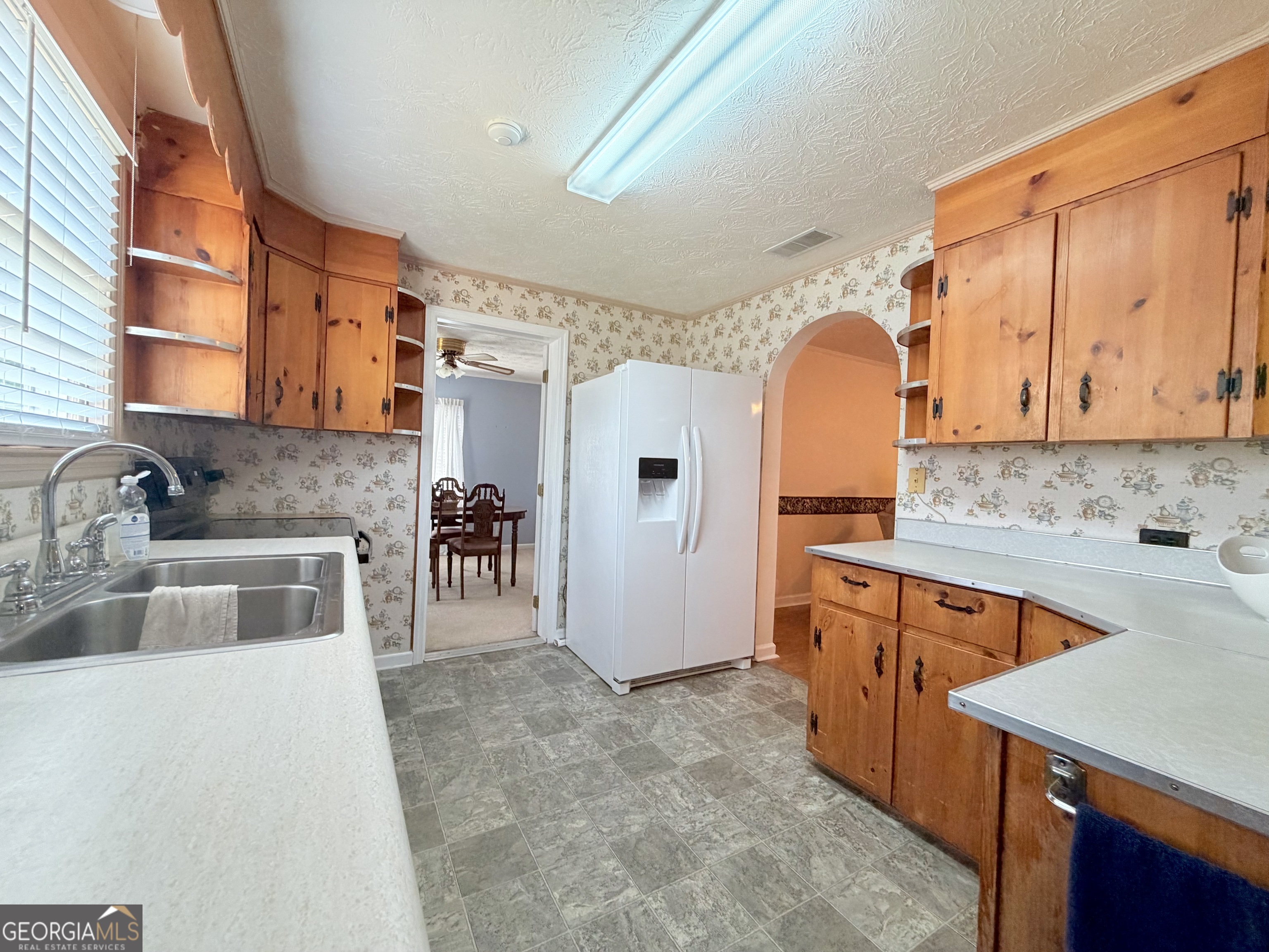 17 2nd Street McRae-Helena, GA 31037 - Photo 11 of 51 a kitchen with stainless steel appliances granite countertop a sink stove and refrigerator
