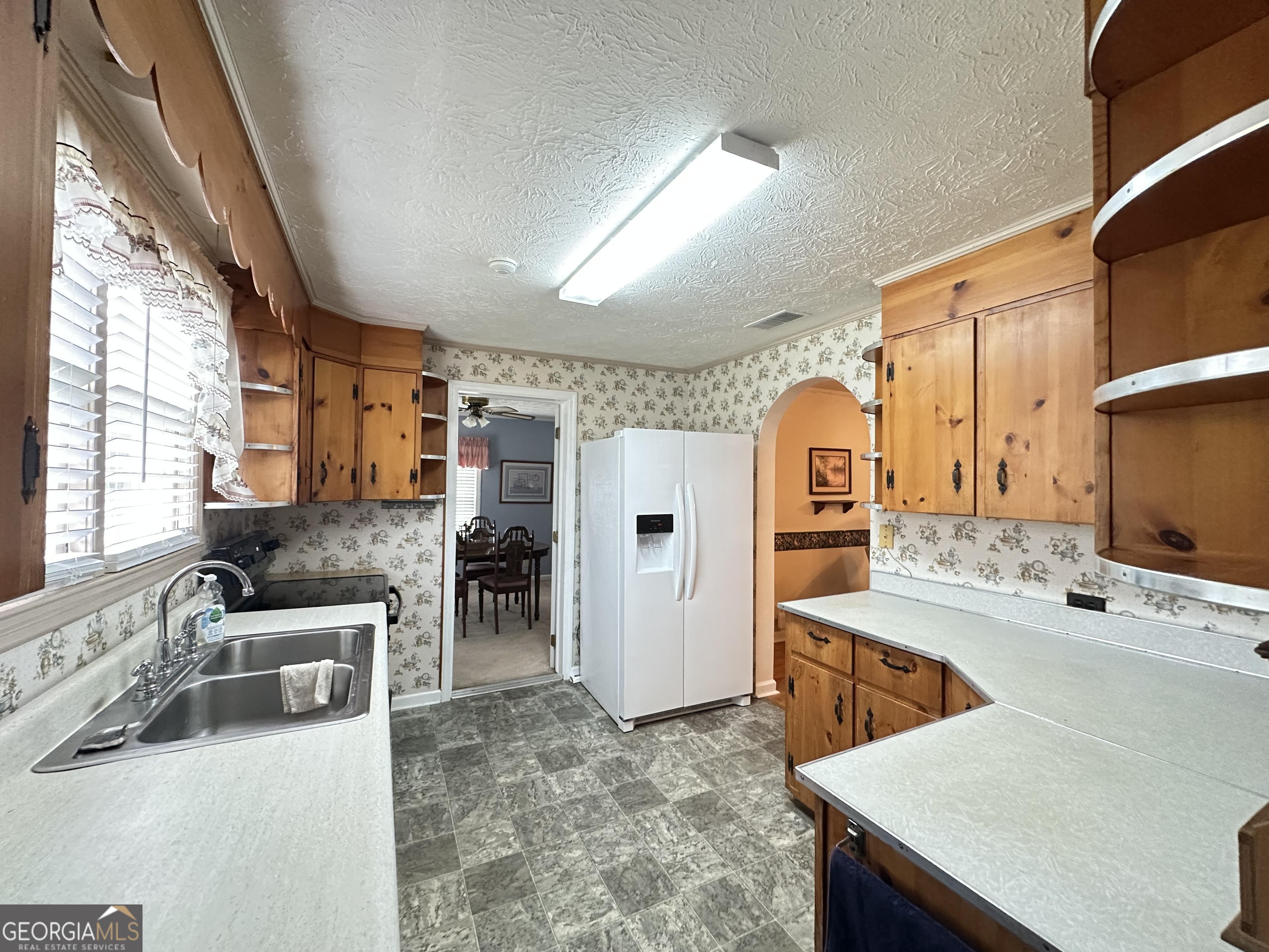 17 2nd Street McRae-Helena, GA 31037 - Photo 12 of 51 a large kitchen with stainless steel appliances microwave and stove