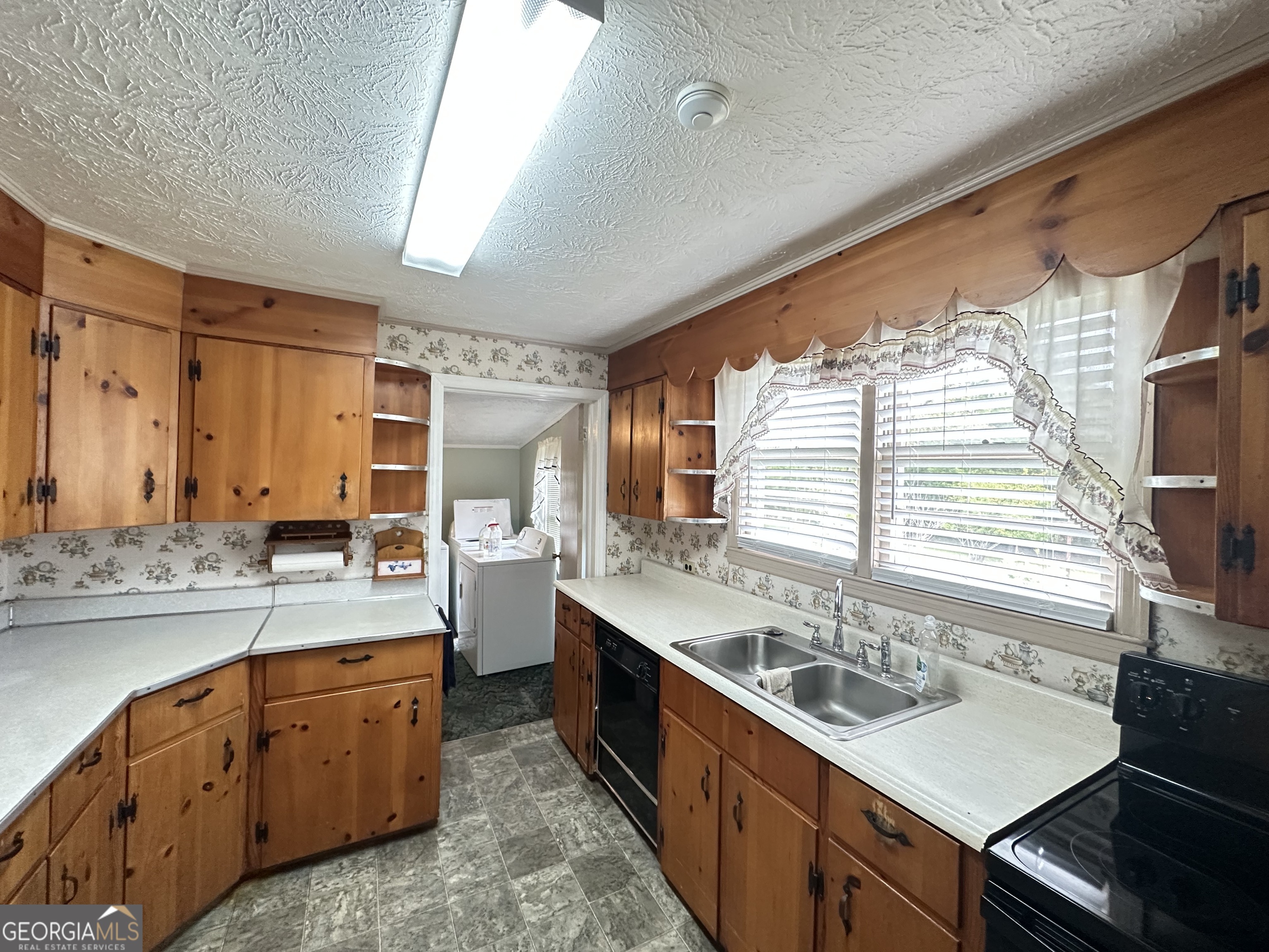 17 2nd Street McRae-Helena, GA 31037 - Photo 13 of 51 a kitchen with stainless steel appliances sink a stove and cabinets