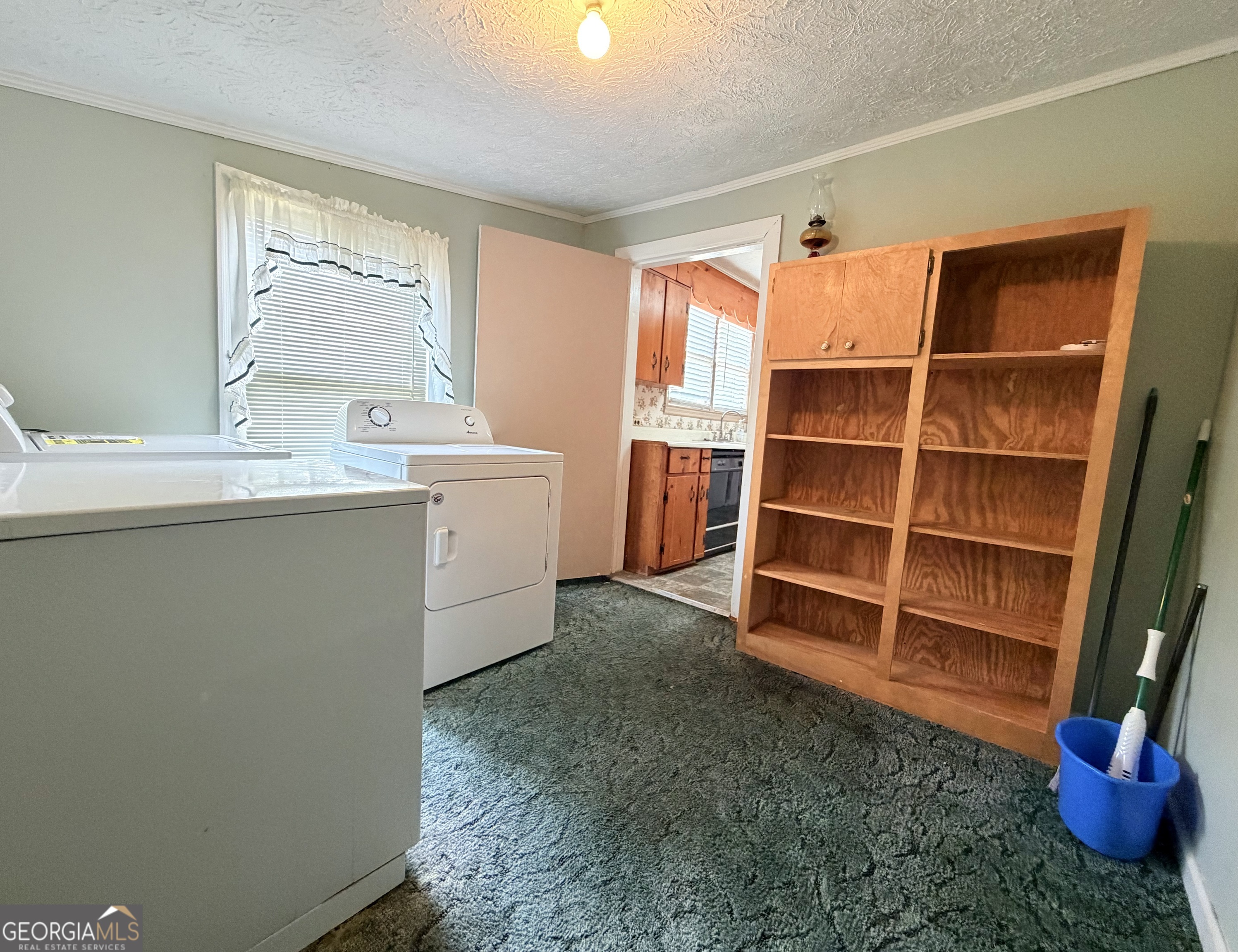 17 2nd Street McRae-Helena, GA 31037 - Photo 15 of 51 a view of cabinets a window and a wooden floor