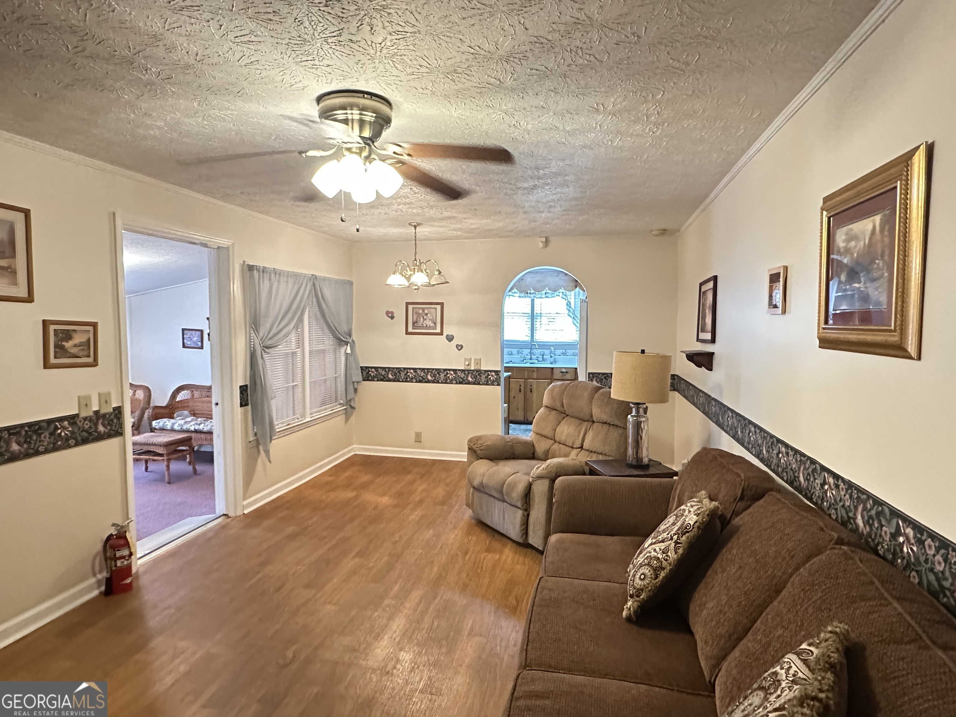 17 2nd Street McRae-Helena, GA 31037 - Photo 17 of 51 a living room with furniture and a chandelier
