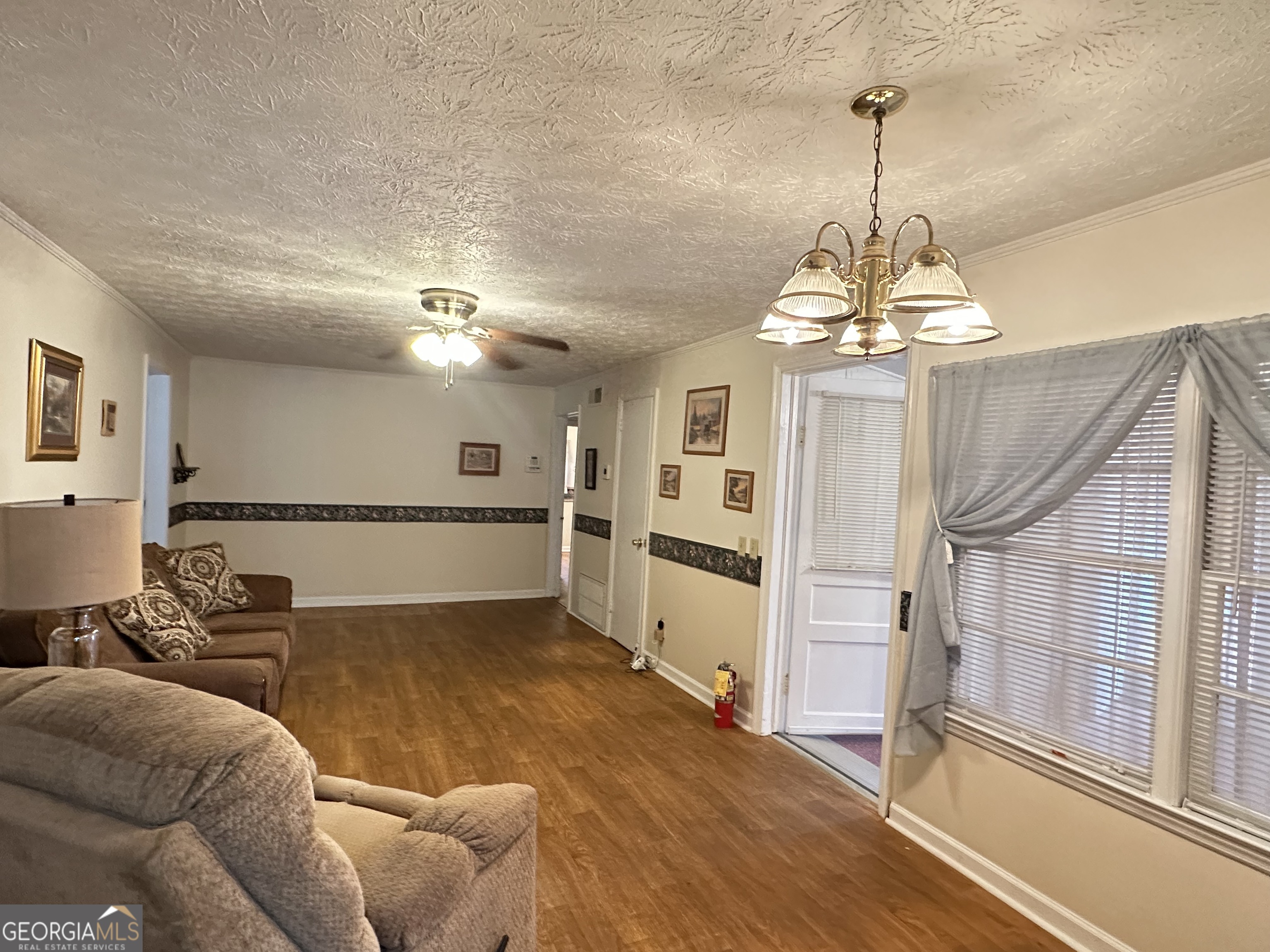 17 2nd Street McRae-Helena, GA 31037 - Photo 19 of 51 a view of a livingroom with a chandelier