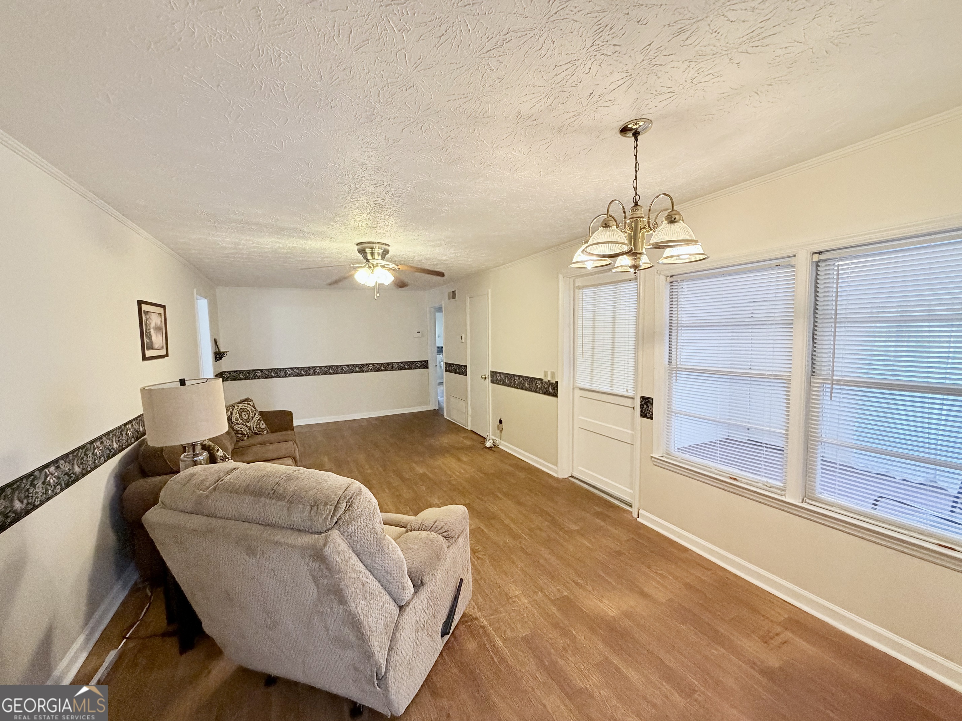 17 2nd Street McRae-Helena, GA 31037 - Photo 20 of 51 a living room with furniture and a chandelier