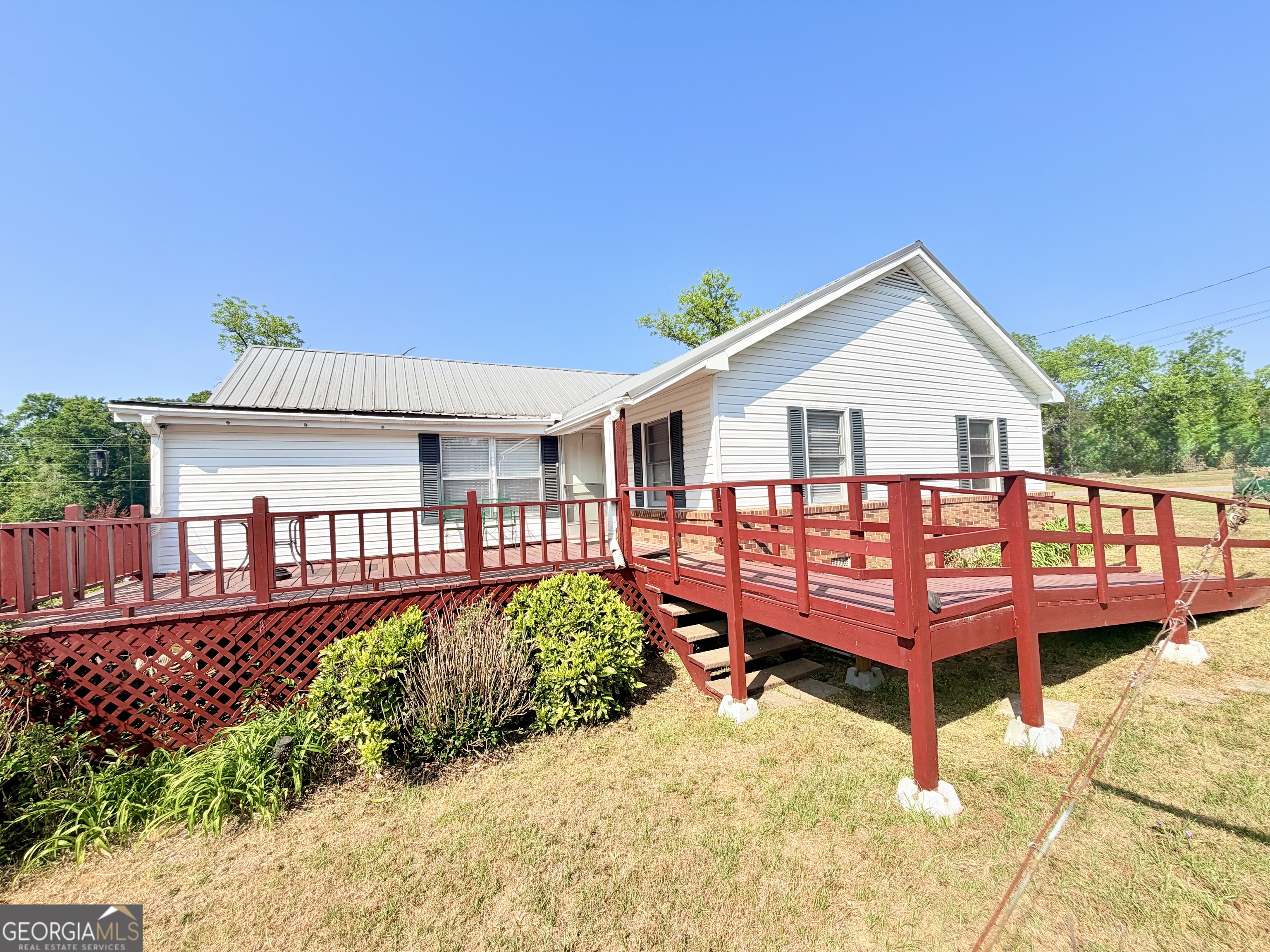 17 2nd Street McRae-Helena, GA 31037 - Photo 2 of 51 a view of a house with wooden deck and furniture