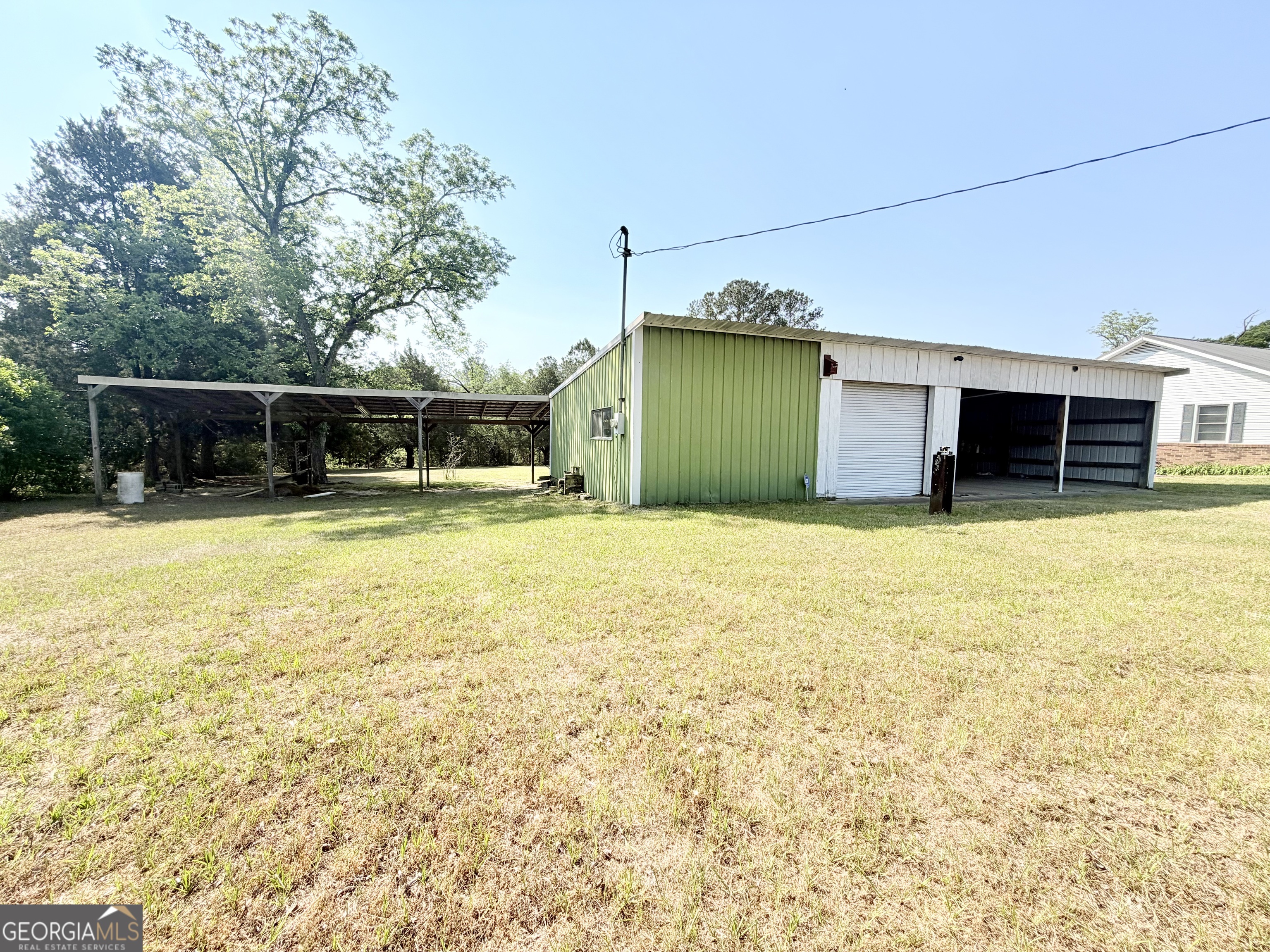 17 2nd Street McRae-Helena, GA 31037 - Photo 33 of 51 a view of a house with a yard and sitting area
