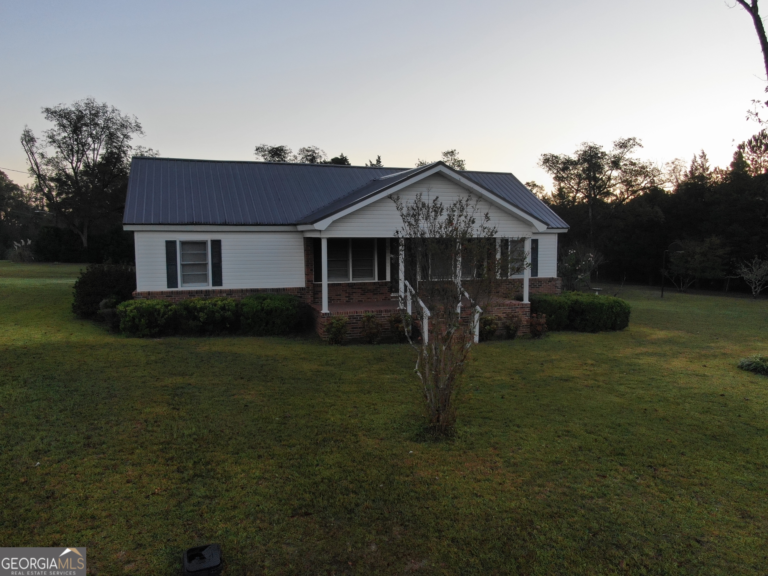 17 2nd Street McRae-Helena, GA 31037 - Photo 43 of 51 a front view of a house with garden