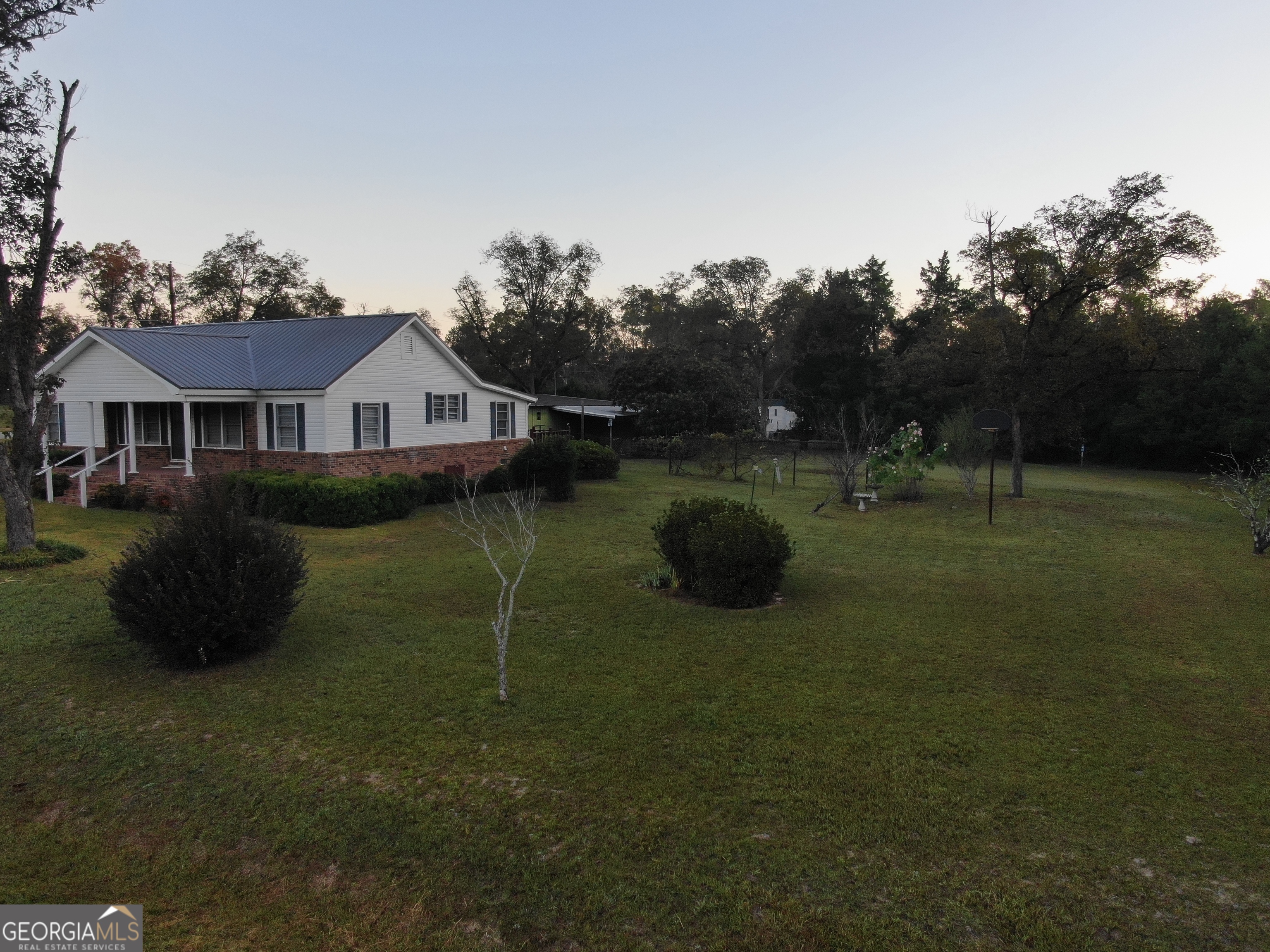17 2nd Street McRae-Helena, GA 31037 - Photo 46 of 51 a view of a house with backyard and garden