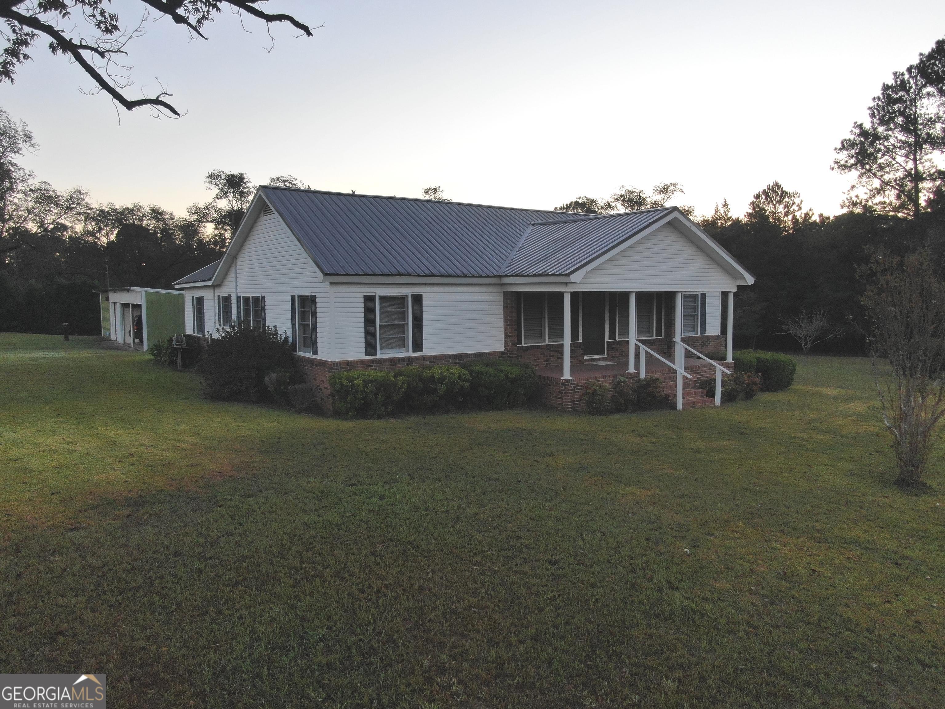 17 2nd Street McRae-Helena, GA 31037 - Photo 47 of 51 front view of a house with a yard
