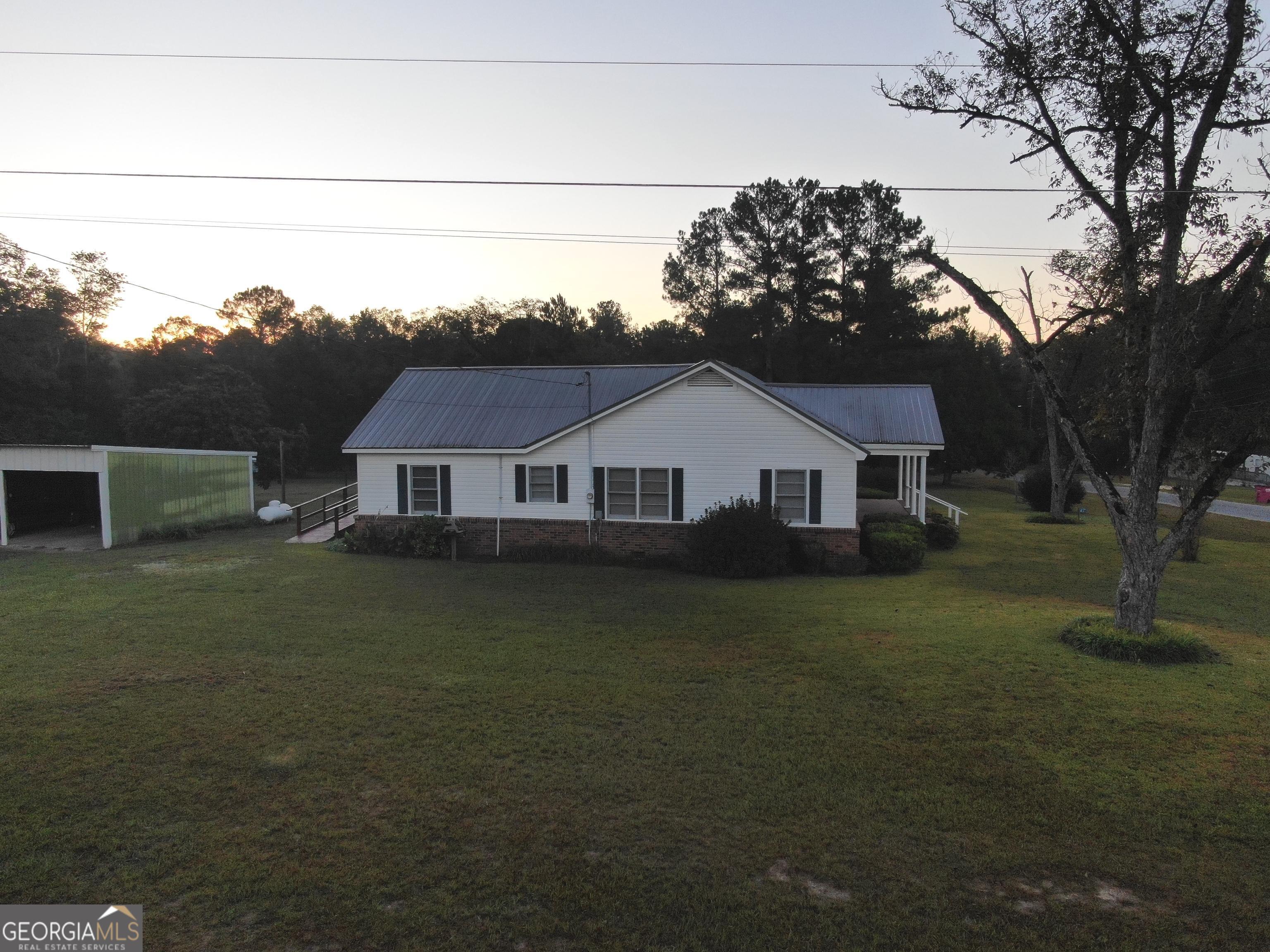 17 2nd Street McRae-Helena, GA 31037 - Photo 48 of 51 a front view of a house with garden