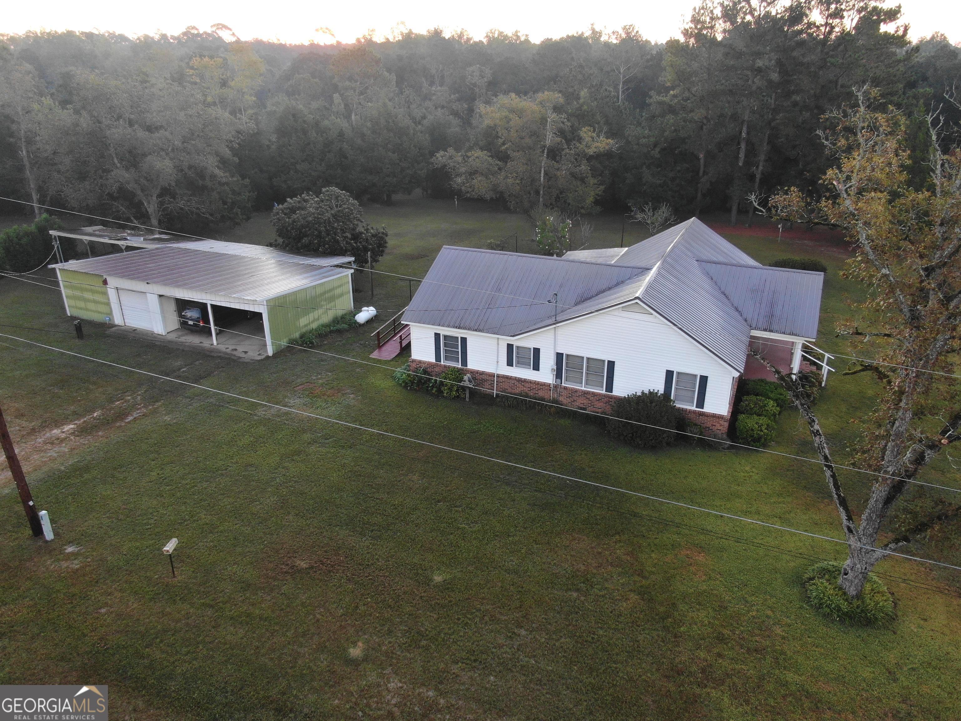 17 2nd Street McRae-Helena, GA 31037 - Photo 49 of 51 a aerial view of a house next to a big yard