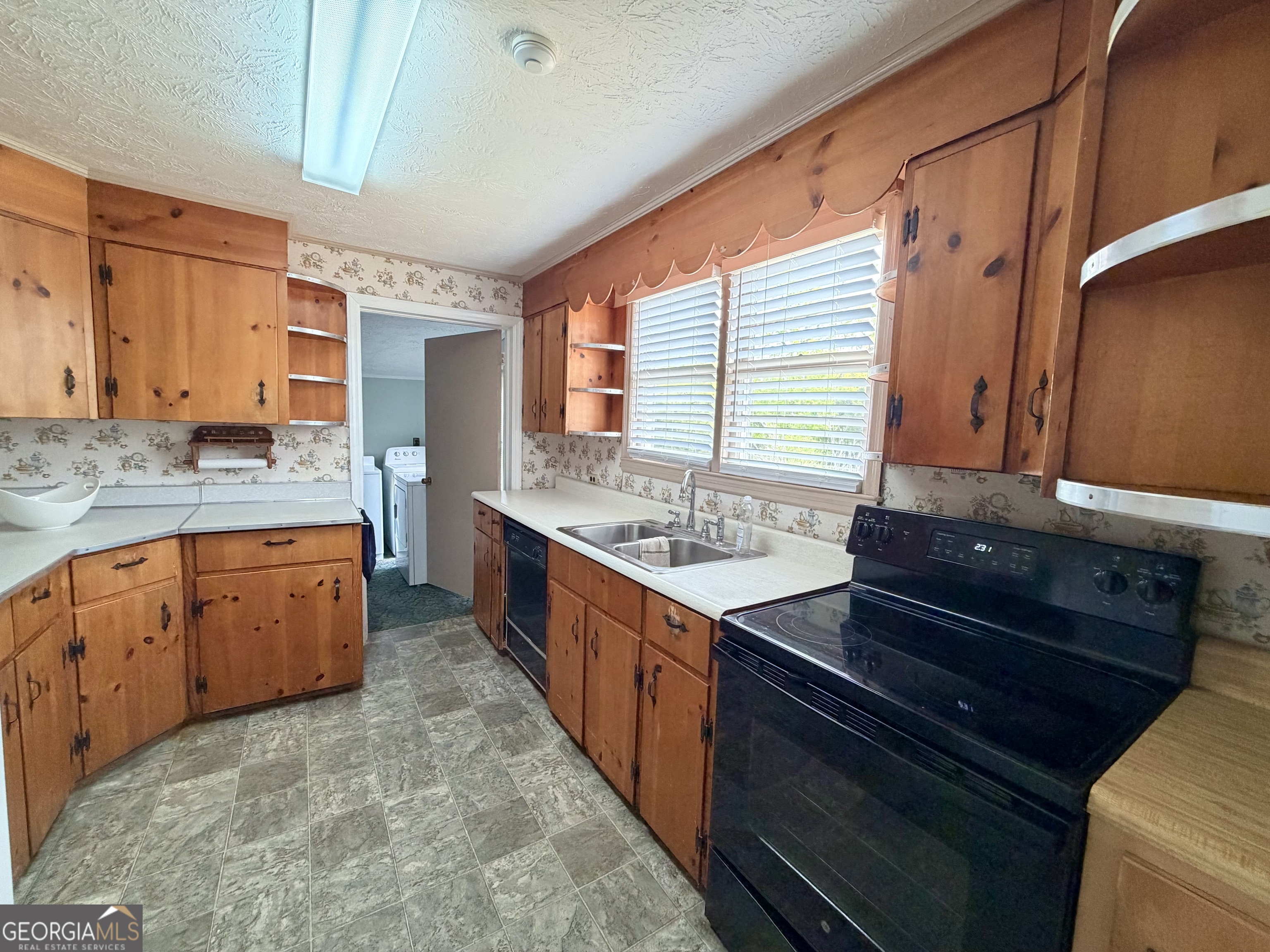 17 2nd Street McRae-Helena, GA 31037 - Photo 9 of 51 a kitchen with stainless steel appliances granite countertop a sink stove and cabinets