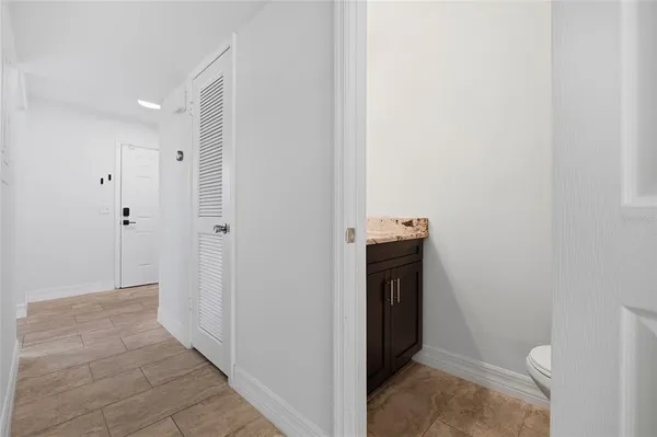 a bathroom with a sink and toilet