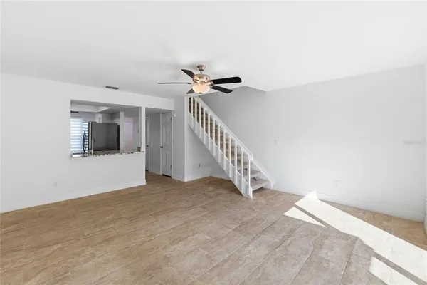 a view of an empty room with a window