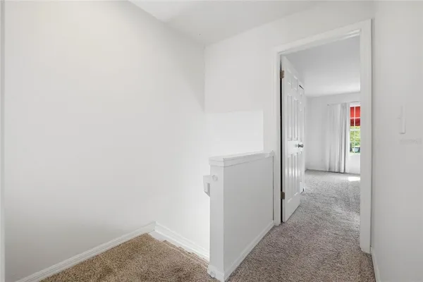 a view of a hallway with closet