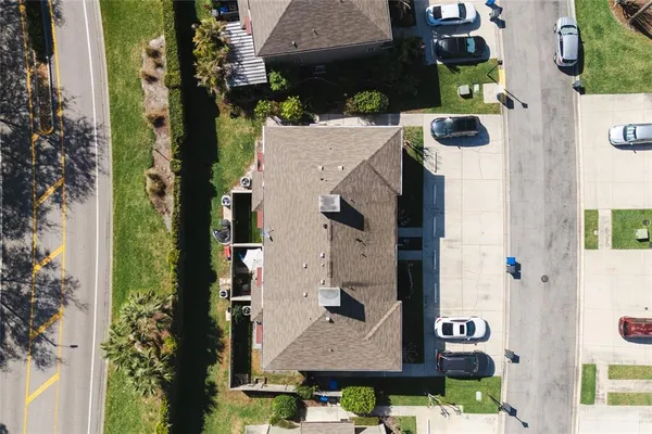 an aerial view of residential houses with outdoor space