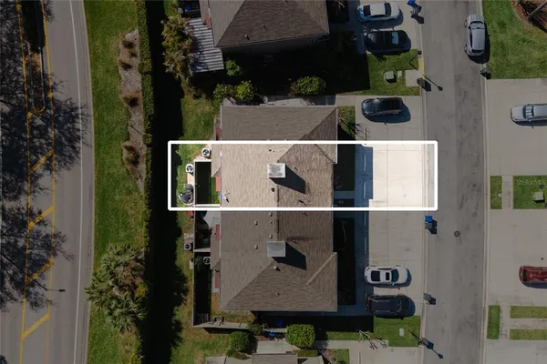 an aerial view of houses with outdoor space