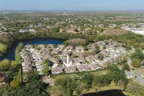 an aerial view of a house with a yard