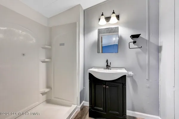 a bathroom with a sink and a mirror