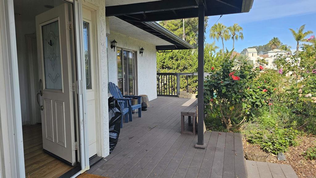 735 Avocado Court, Unit GUEST HOUSE Del Mar, CA 92014 - Photo 9 of 12 a view of a porch with furniture and floor to ceiling window