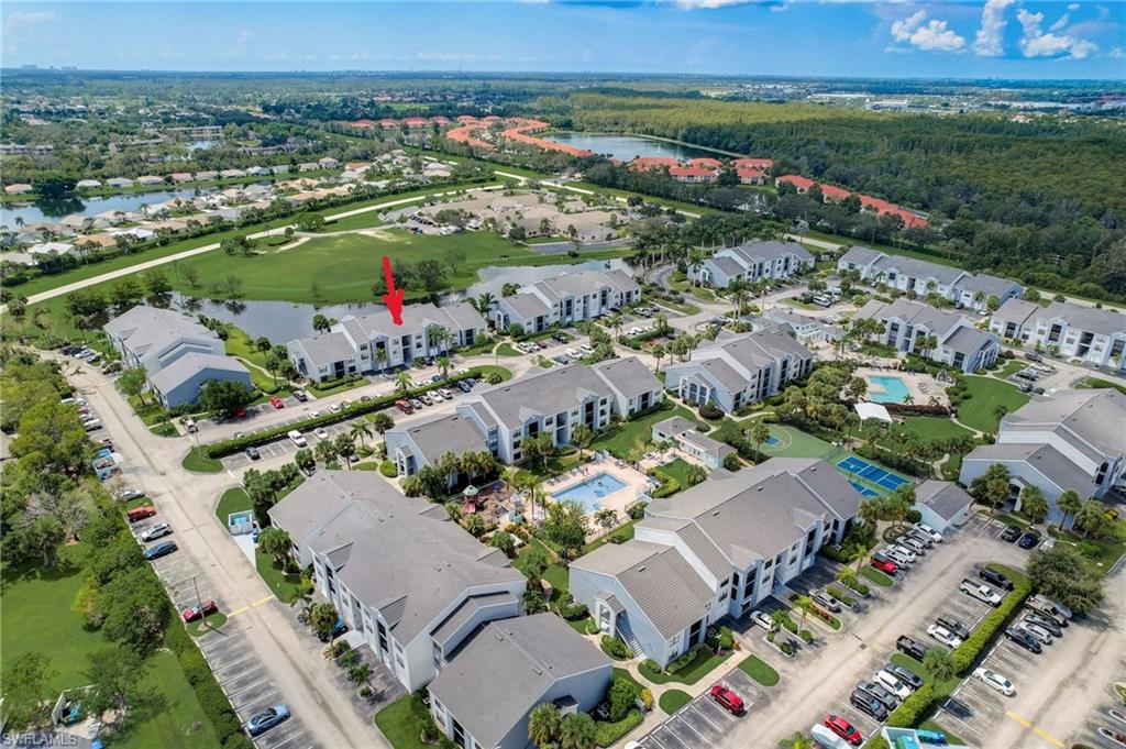13615 Eagle Ridge Drive, Unit 1614 Fort Myers, FL 33912 - Photo 1 of 34 Multi-story residential building featuring a light gray and blue exterior facade
