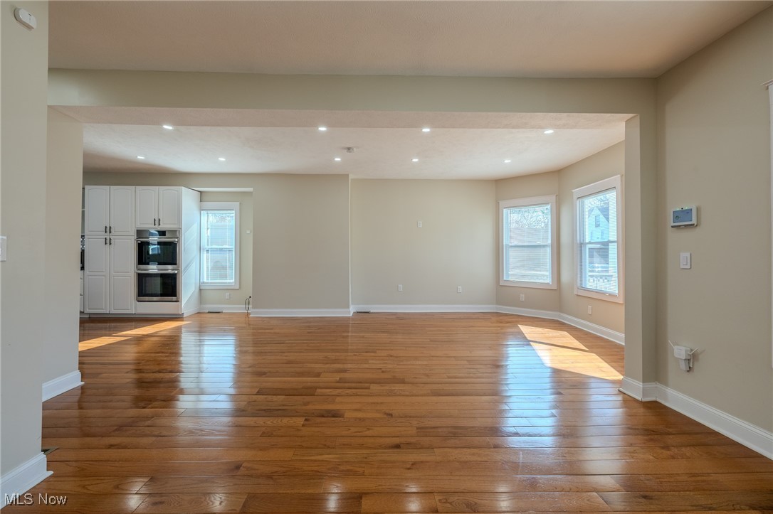 3516 Broadview Road Cleveland, OH 44109 - Photo 7 of 42 Unfurnished living room featuring hardwood / wood-style floors, recessed lighting, and baseboards
